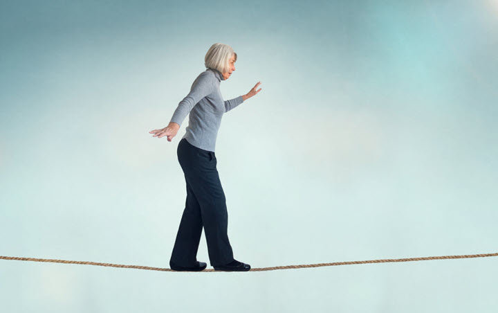 senior woman on tightrope does not have balance problems but many seniors do have balance issues