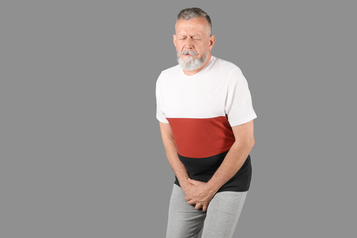 mature man with urinary tract infection suffering and showing symptoms