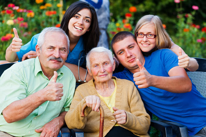 older woman with alzheimers and her caregivers