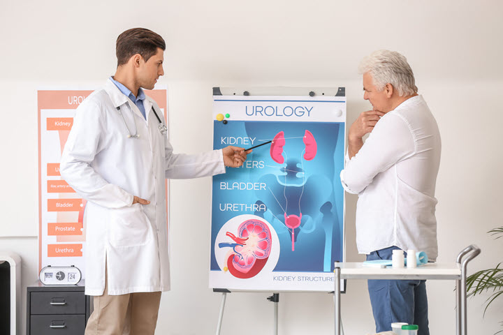 urologist explaining a urinary tract infection treatment to a senior